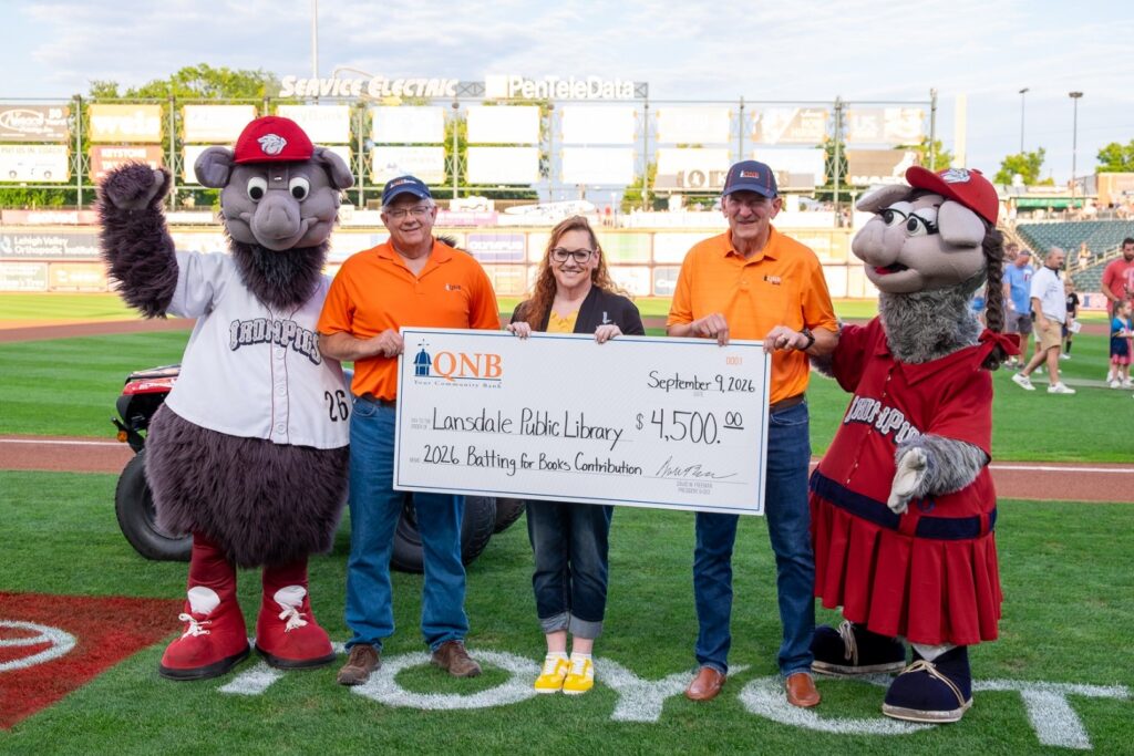 Lipsky receives a check from QNB for Batting for Books